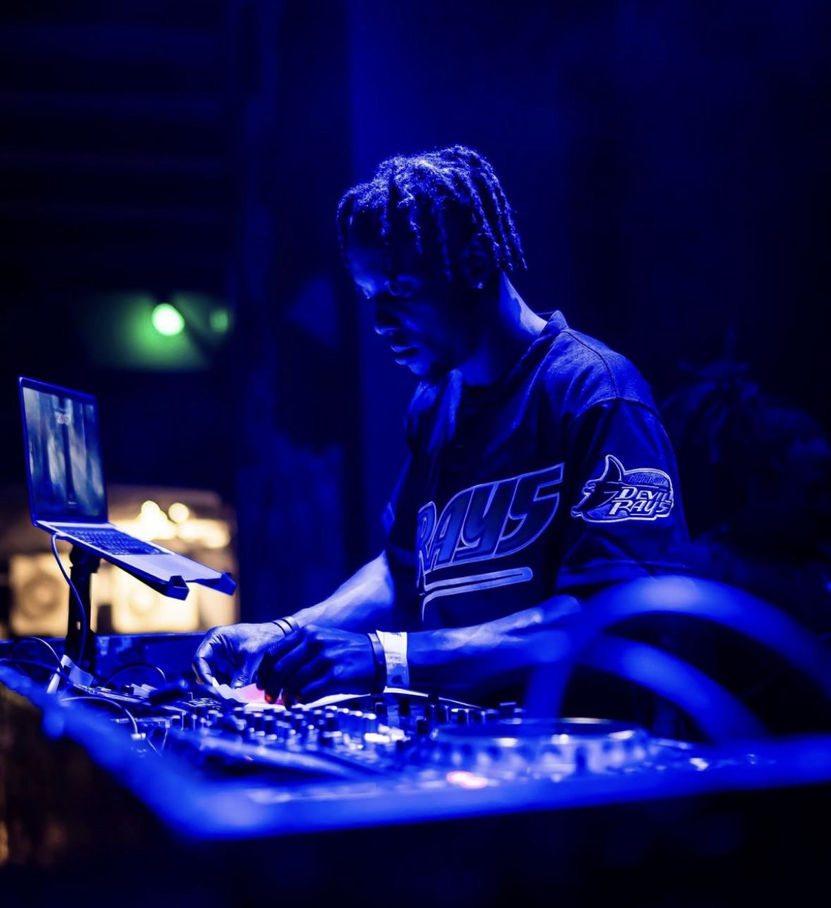 DJ Spacecamp mixing under blue lights